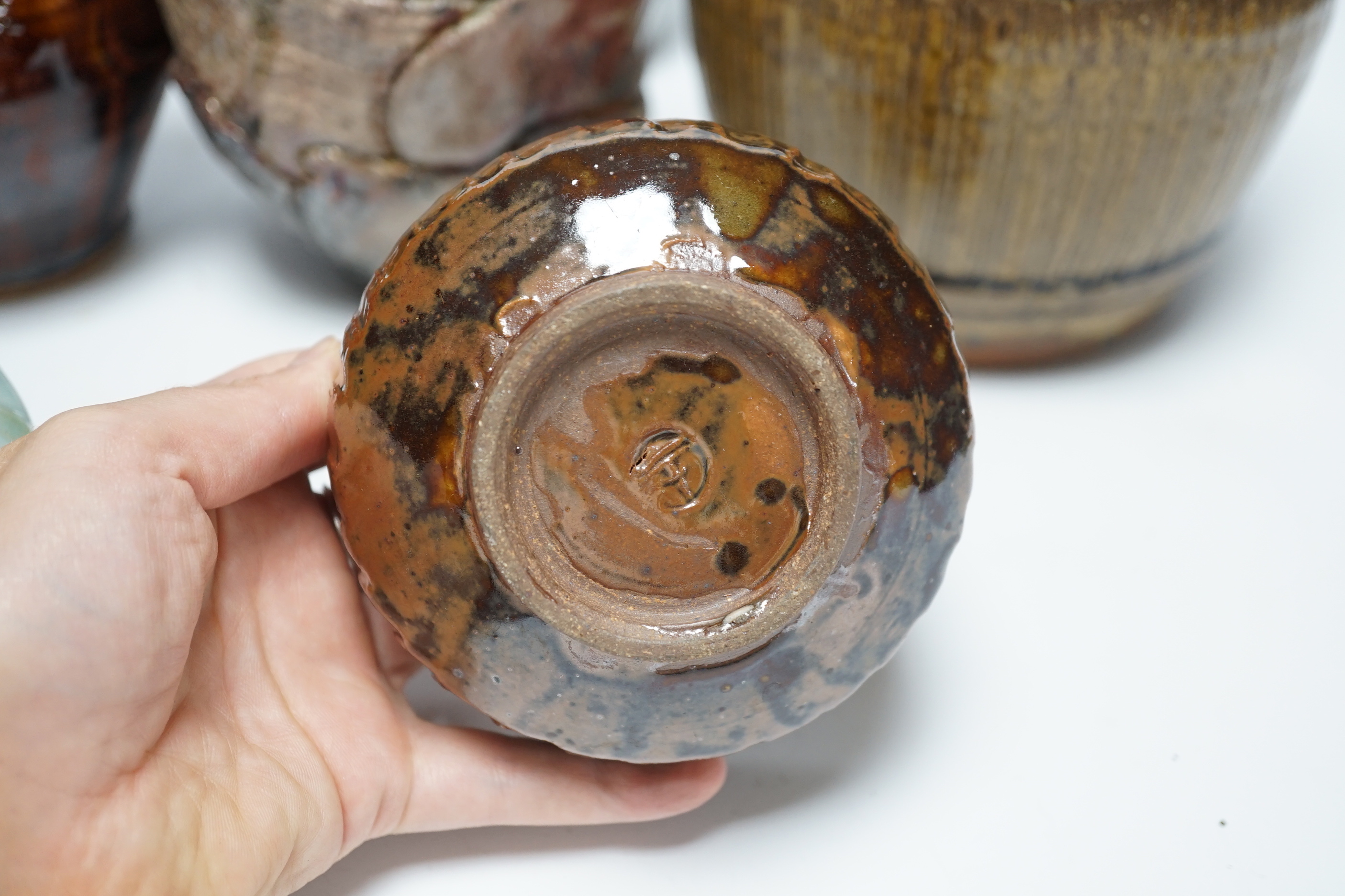 Studio ceramics to include a St. Ives moulded jug and an ash glazed jar and cover marked 'MD' etc. St Ives jug 15cm high